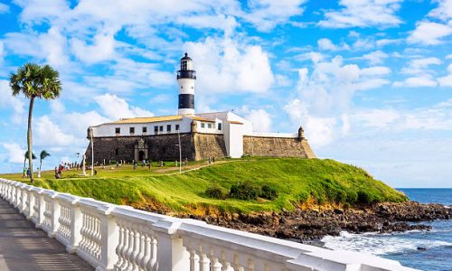Salvador da Bahia, Brazil - May 29, 2016: View of Farol da Barra Lighthouse at Barra beach in Salvador da Bahia, Brazil. Dating from the year 1698, it is said to be the oldest lighthouse in South America.